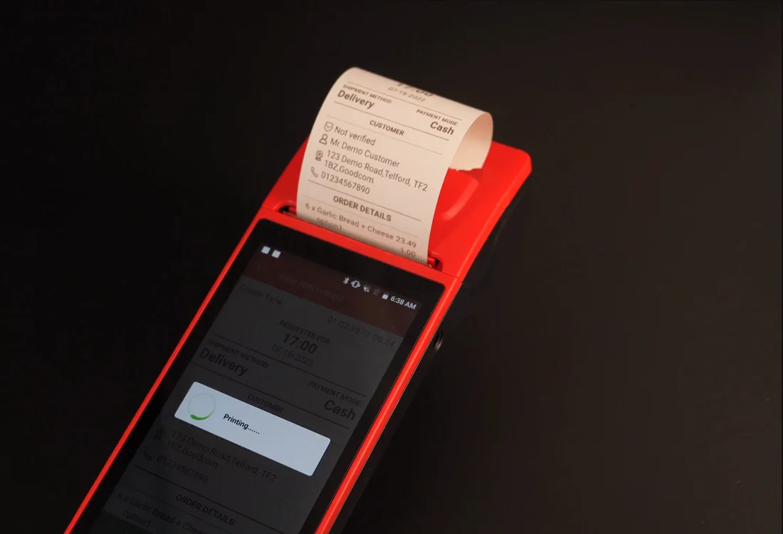 A JET standalone card terminal printing a receipt