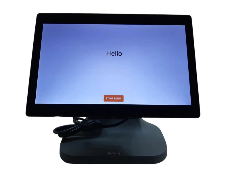 A SUNMI T2 Android POS terminal on its base, showing the first-run setup screen